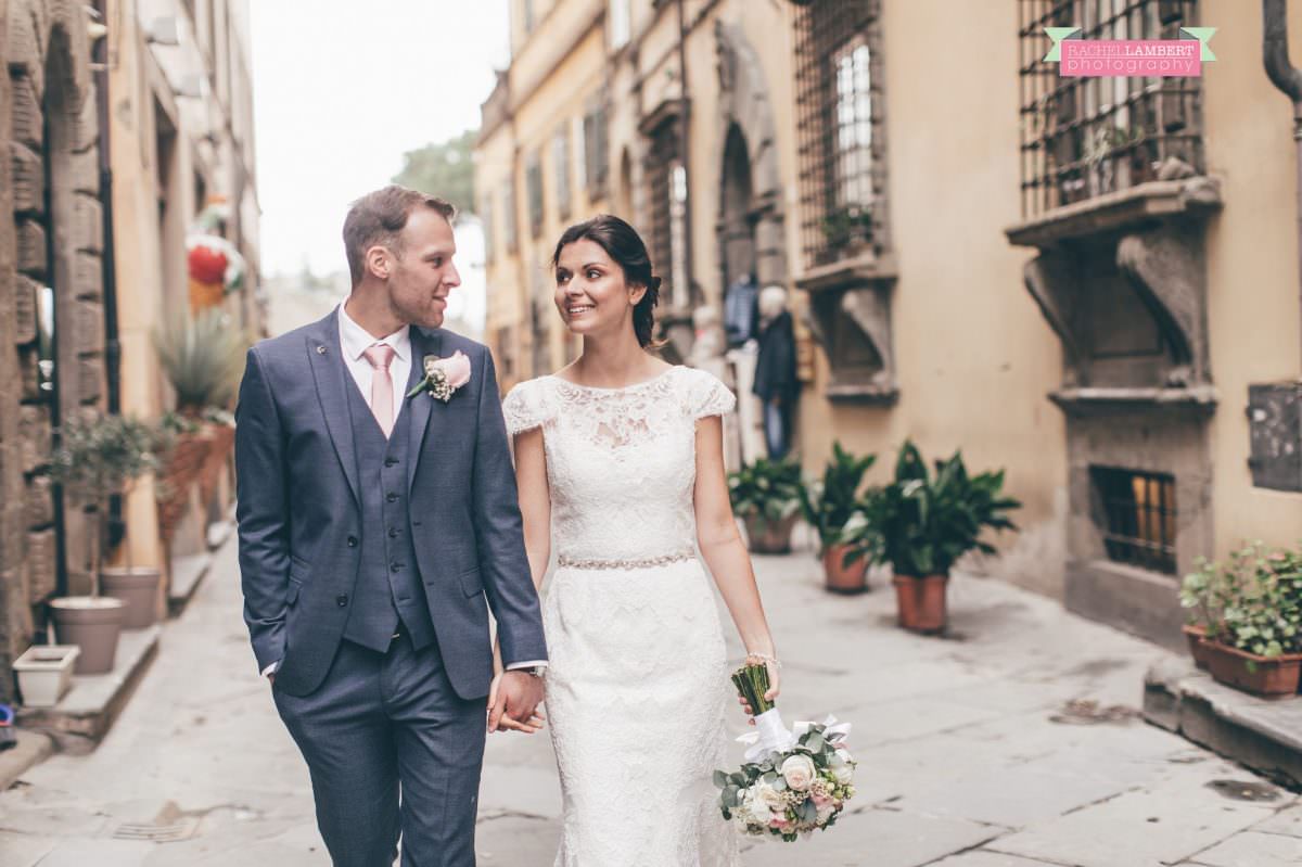 bride and groom portrait wedding in italy colour cortona tuscany walking through streets